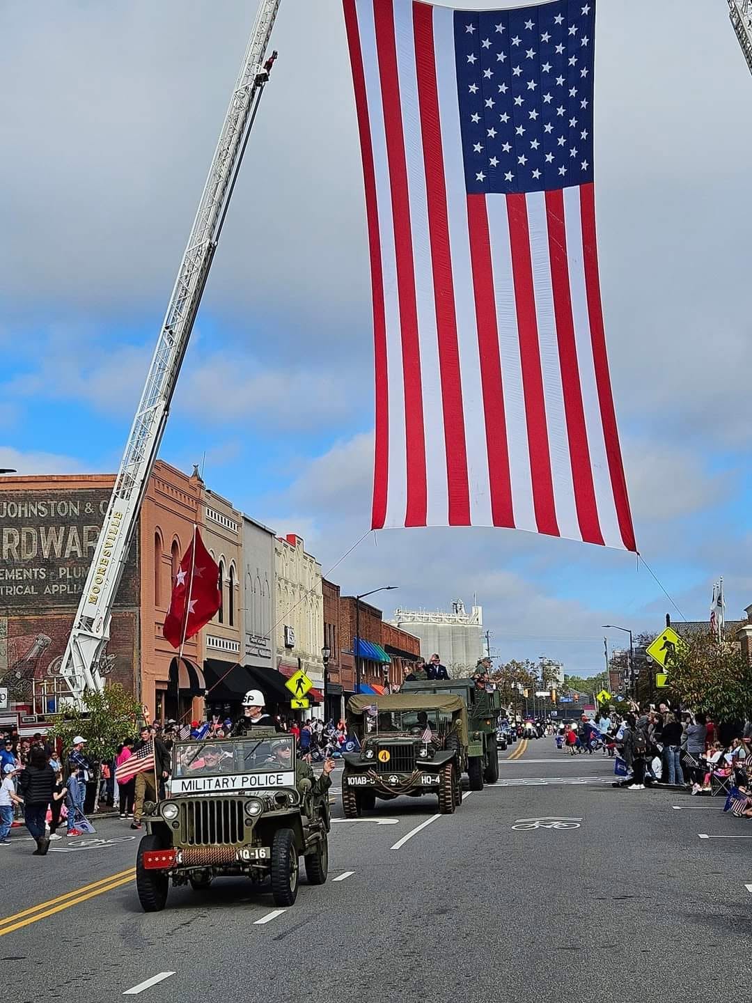 A military vehicle leading the parade procession
