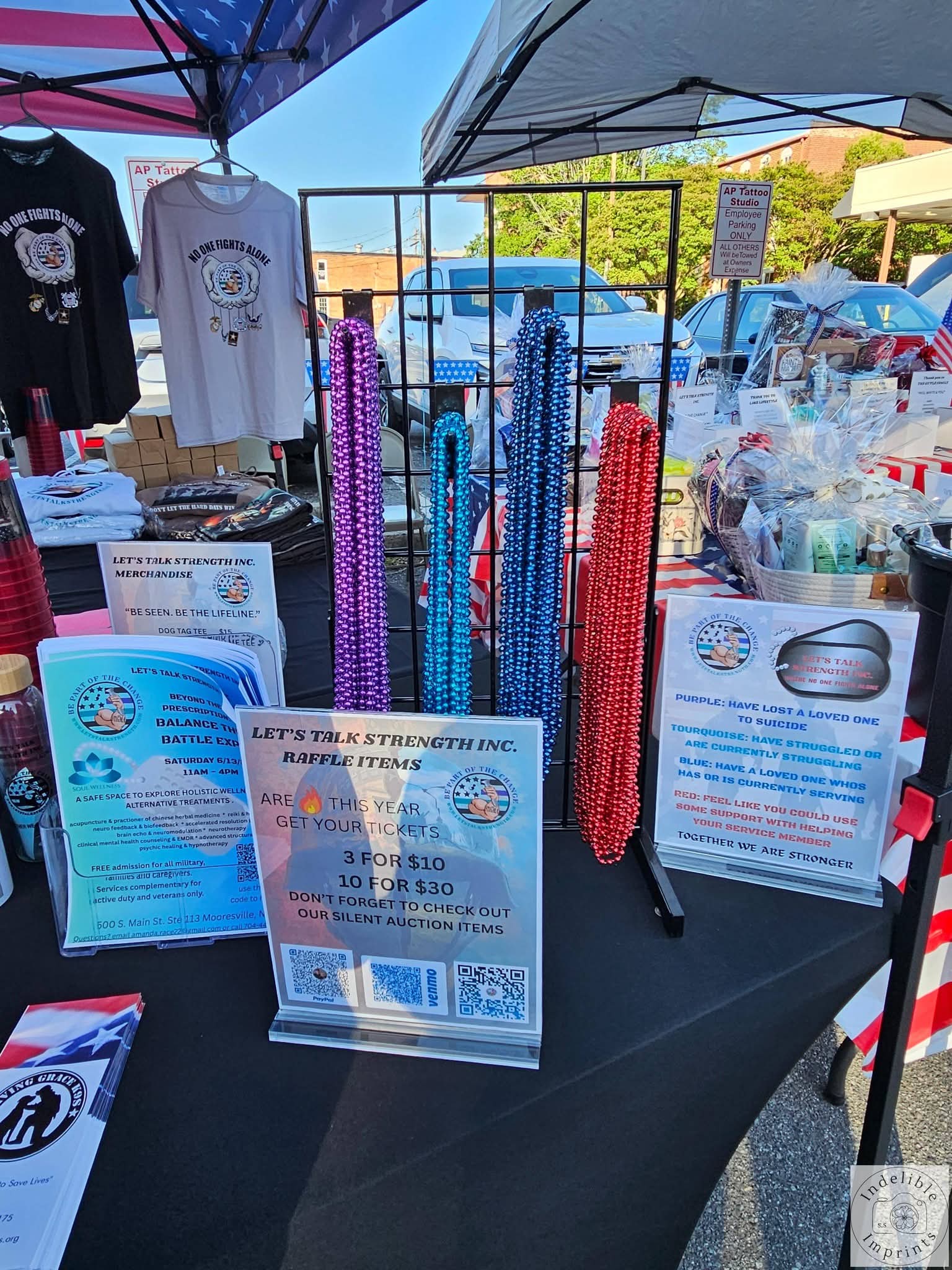 Let's Talk Strength awareness beads and merchandise on display at a community event